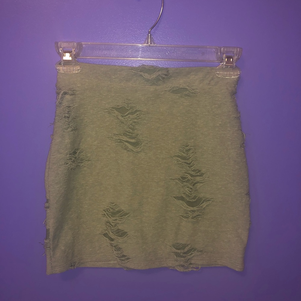 Green ripped skirt, has fabric underneath.